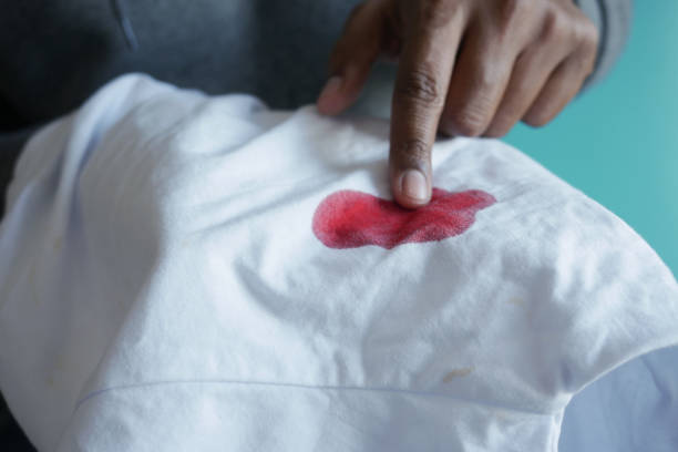 istock blood stains on a white shirt. 2149840049