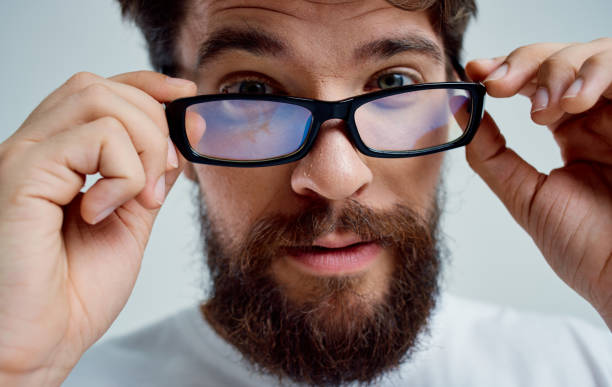 istock bearded man in white t-shirt with glasses vision problems 2149840849