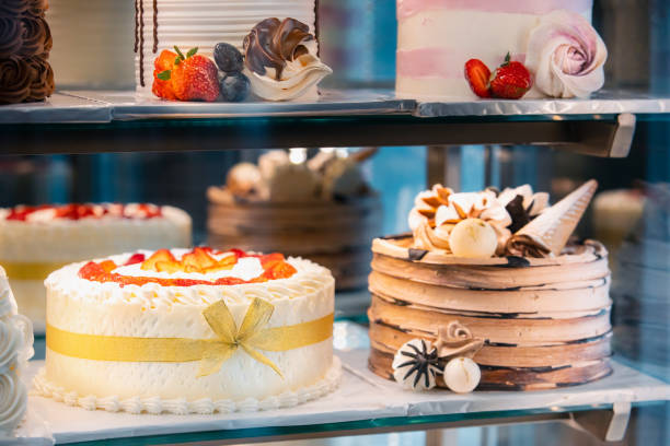istock cake with strawberries, yummy assortment baked pastry in bakery. Various Different Types Of Sweet Cakes In Pastry Shop Glass Display. Good Assortment Of Confectionery. buffet with many desserts 2149841484
