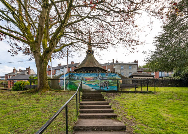 Crediton, UK. 18 April 2024. Painted wall in a park in Crediton.