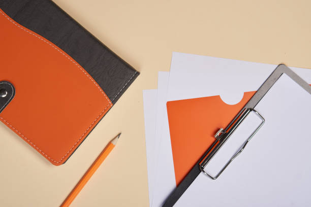 istock Notepad with pen stationery accessories beige background 2149844953