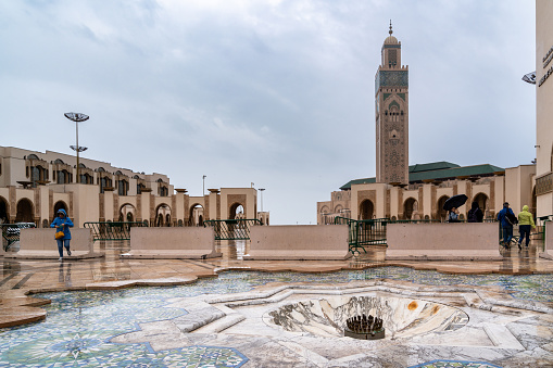Casablanca, Morocco -march 25, 2024:People visit the famous Hassan Second Mosque during a rainy day