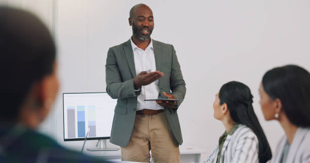 istock Business, presentation and man coaching with statistics on ideas, growth and development at workshop. Leadership, strategy and planning, speaker or presenter at corporate conference or office seminar 2149847786