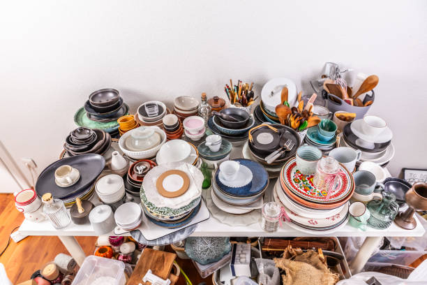istock Kitchen clutter, utensils and kitchenware on a table. Concept of tidying and decluttering 2149848657