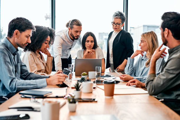 istock A team of business people working in a modern office. Discussion of work issues. Copy space. 2149849751