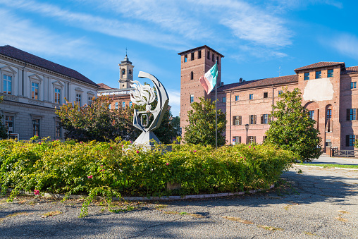Vercelli, Italy - October 12, 2020: Square with a flowerbed and a castle dates back to the 13th century, currently seat of the Palace of Justice, court of Vercelli and the monument to the Carabinieri, square Amedeo IX. Vercelli, important city in northern Italy, Piedmont region