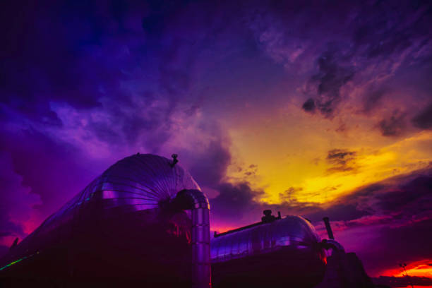Sunset over urban city with power poles and gradient sky, capturing peaceful evening cityscape and warm urban atmosphere concept.