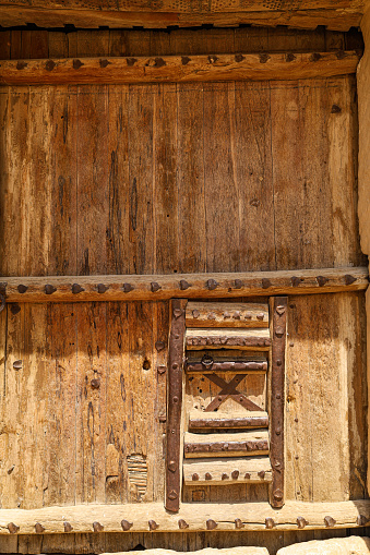 Riyadh, Saudi Arabia, April 13 2024. Old vantage wooden door and gate of the fort Al Masmak Palace Riyadh, Saudi Arabia