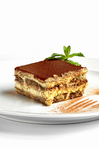 Step-by-step guide to Tiramisu, a classic Italian dessert with biscuits, mascarpone cheese and chocolate powder.