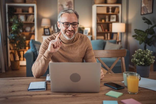 istock Middle aged man working from home office on laptop 2149855577