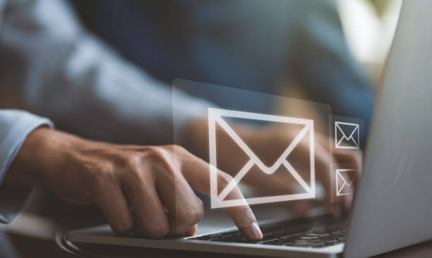 istock Businessman hands using Laptop typing on keyboard and surfing the internet on office table with email icon, email marketing concept, send e-mail or news letter, online working internet network. 2149856786