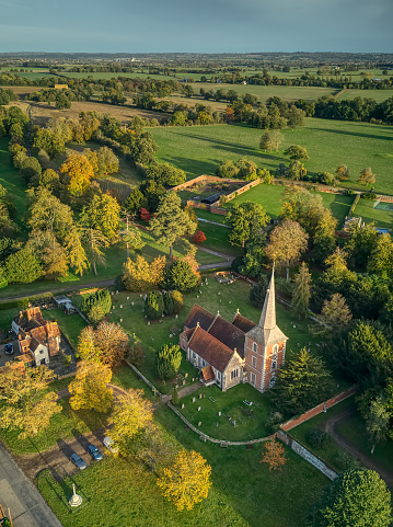 Aerial shot looking over all saints church Terling