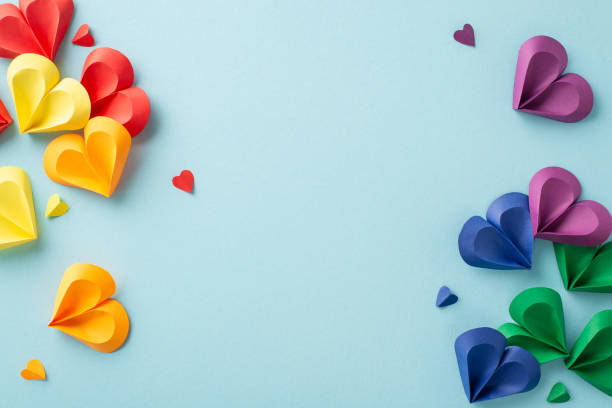istock A creative arrangement of multi-colored paper hearts in various sizes spread over a light pastel background, celebrating diversity and love 2149858837