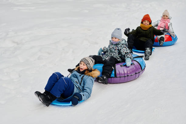 istock Riding down hill on slides and tubes 2149859004