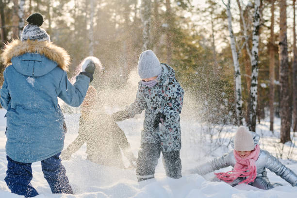 istock Youthful friends playing snowballs 2149859030