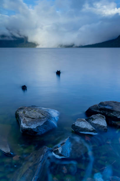 A high-angle shot of the shoreline with calm water