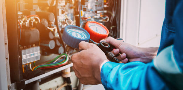 istock Technician is checking air conditioner refrigerant leak. 2149859234