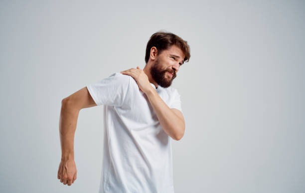 istock man has shoulder pain and white t-shirt dislocation health problems 2149859387