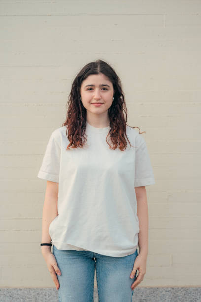 istock Young woman standing against a neutral background 2149860693