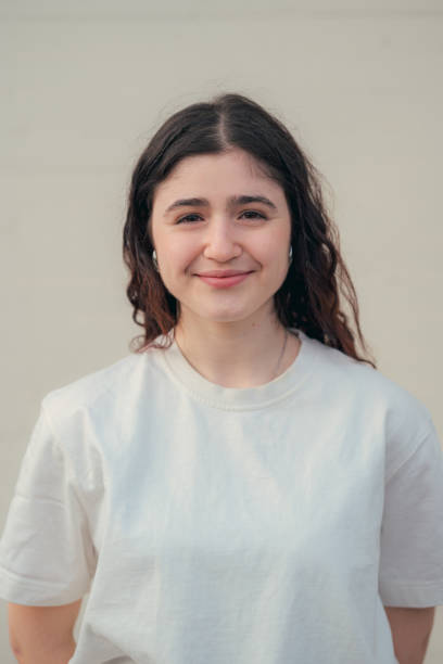 istock Woman smiling and wearing white shirt 2149860706