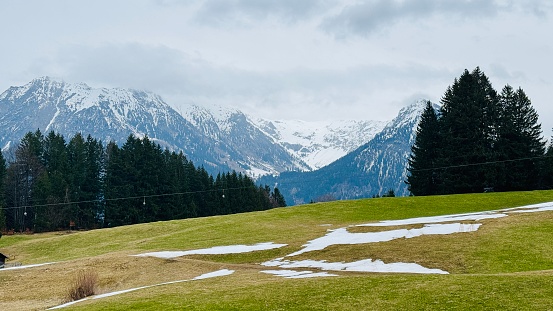 Allgau mountains, meadow with rest of snow