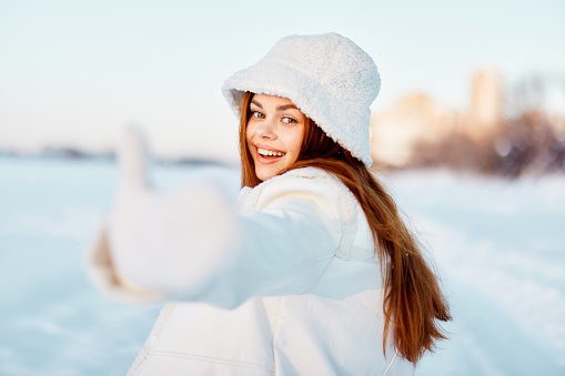 young woman red hair snow field winter clothes Fresh air. High quality photo