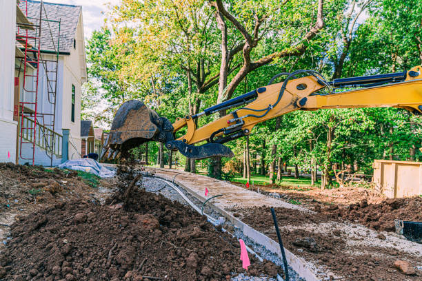 istock Excavator Unloading a Scoop of Dirt at a Construction Site 2149863931