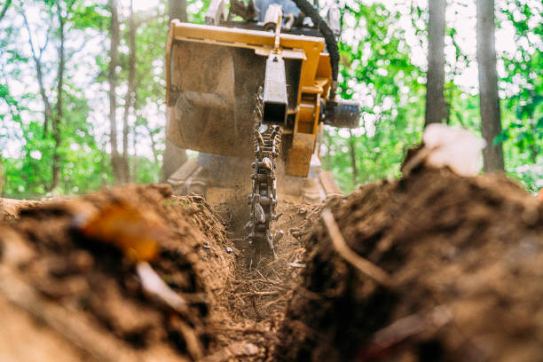 istock Trench Digger Cutting Soil for a PVC or Electrical Line 2149864250