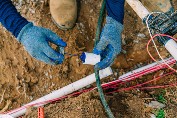 istock Irrigation Construction Worker using Blue PVC Cement or Primer on Sprinkler Pipe 2149864439