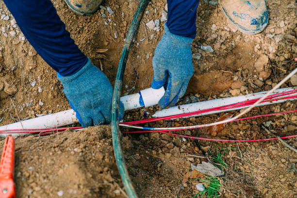 Irrigation Worker Connecting a Joint on a sprinkler pipe with PVC Cement