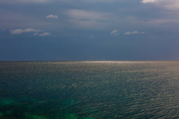 Seascape with horizon line. Clear sea and blue sky. Nature, sea, vacation, travel and backgrounds concept. Horizontal.