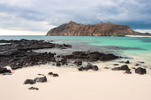 Galapagos Islands. Ecuador. View of the beach. Traveling in Ecuador. Cliffs on the Galapagos Islands. Deserted beach.