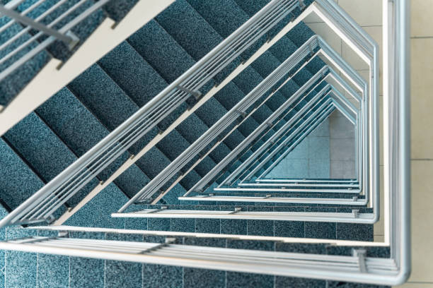 istock Stairs going down in a modern office building 2149865869