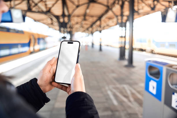 istock Smart Phone mock up at the train station 2149865909