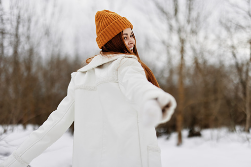 young woman red hair walk in the fresh winter air fresh air. High quality photo