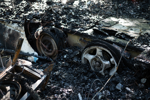 The remains of a burnt out mobile home trailer.