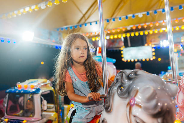 istock Girl riding a horse on a carousel 2149872377
