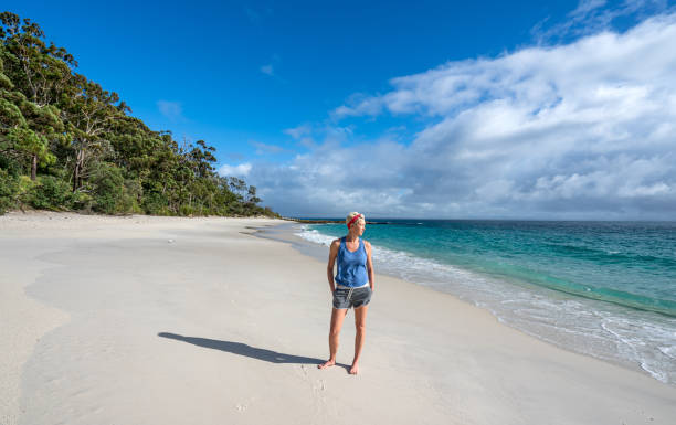 istock Woman Exploring a Beautiful White Sand Beach in Eastern Australia 2149872616