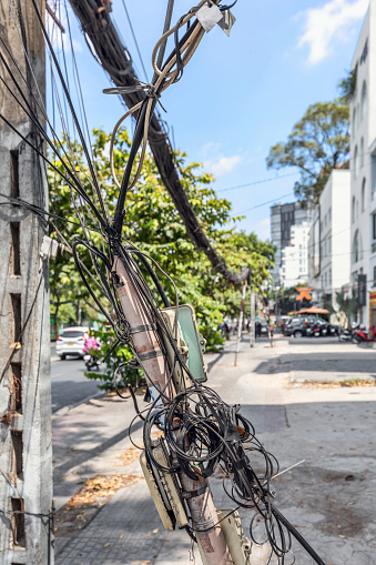A chaos of electrical cables and wires in the center of Ho Chi Minh City, Vietnam