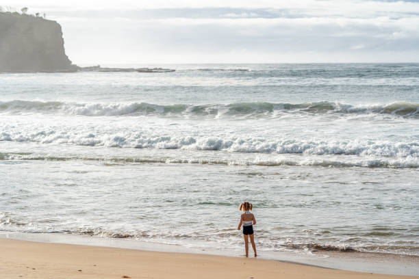 istock Young Girl Playing at a Beautiful White Sand  Beach in Eastern Australia 2149873285