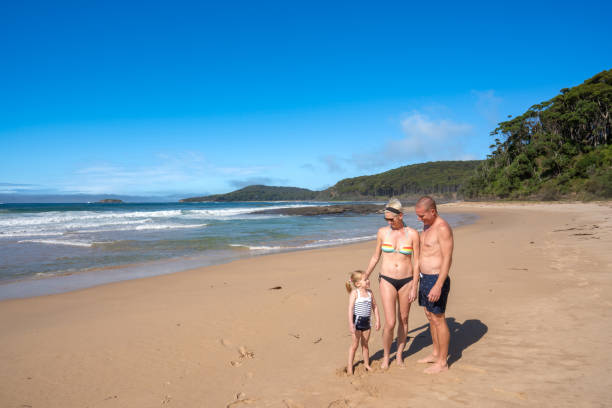 istock Mother, Father, and Daughter exploring a Beautiful Sandy Beach in Eastern Australia 2149873321