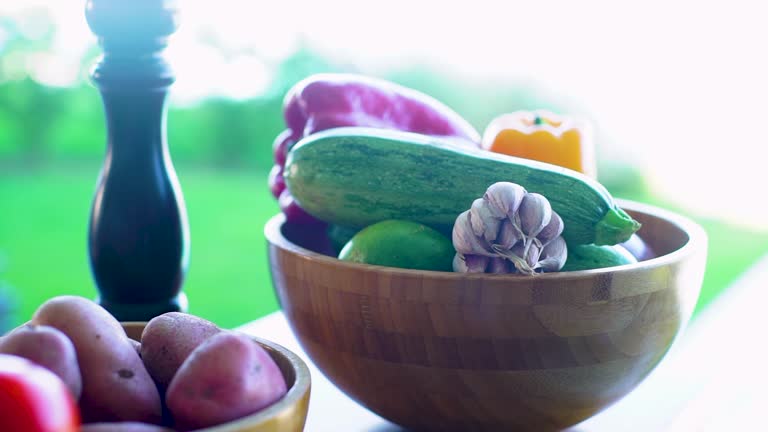 Fresh Vegetables in Wooden Bowl on Sunlit Counter