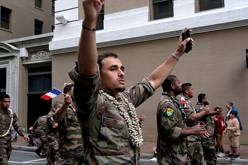Norfolk, Virginia: USA:  April 20th 2024:  The French military marches in downtown Norfolk, Virginia parade celebrating 75 years that the NATO parade has taken place.