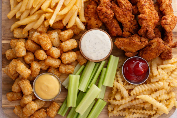 istock Fried chicken and french fries board with dipping sauces 2149878708