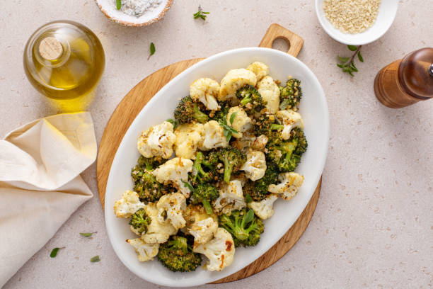 Roasted cauliflower and broccoli on a serving plate, healthy vegetable side dish