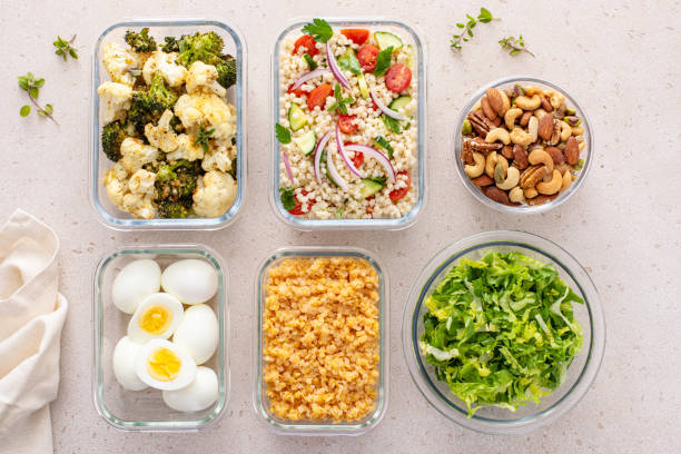 istock Healthy vegetarian meal prep with boiled eggs, roasted vegetables, cooked lentils, couscous salad and nuts 2149879739