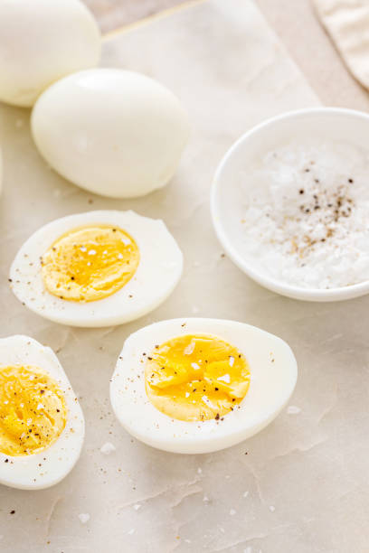 istock Boiled eggs peeled and cut in half with salt and pepper 2149879741