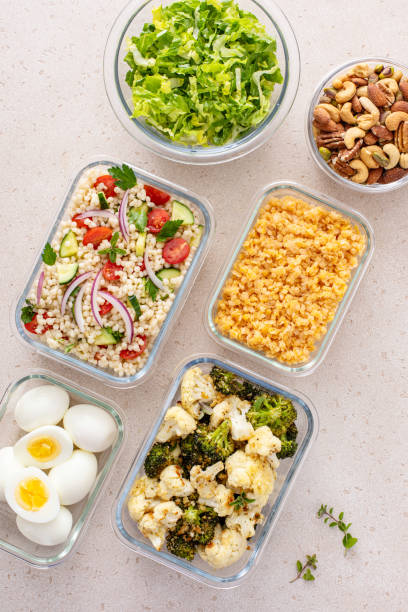 istock Healthy vegetarian meal prep with boiled eggs, roasted vegetables, cooked lentils, couscous salad and nuts 2149879746