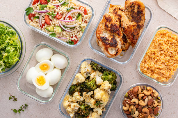 istock Healthy meal prep with cooked chicken breast, boiled eggs, roasted vegetables, cooked lentils, couscous salad and nuts 2149879753