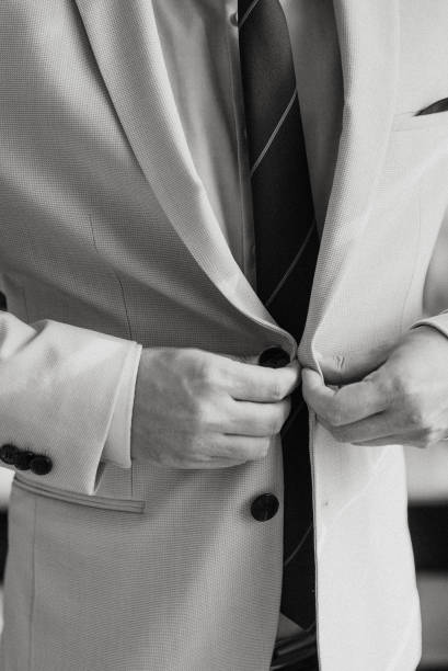 istock Guy is getting dressed for a business meeting. 2149884070